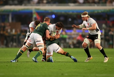 180726 - South Africa v Wales - Nations Championship - Teddy Williams of Wales is tackled by Pieter-Steph du Toit and Jasper Wiese of South Africa 