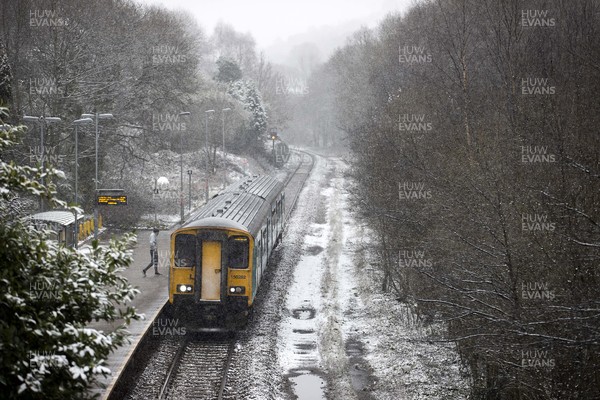 310121 - Picture shows the snow falling on the train line in the Rhondda town of Ferndale The area has experienced wide spread snowfall for the second weekend in a row
