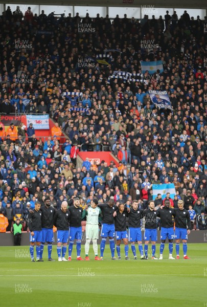 090219 - Southampton v Cardiff City, Premier League - Cardiff City players observe a minutes silence in front of the travelling fans in memory of Emiliano Sala at the start of the match