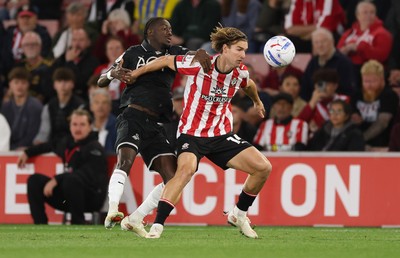 080926 - Southampton v Swansea City, EFL Sky Bet Championship - James Bree of Southampton is challenged by Moussa Yeo of Swansea City