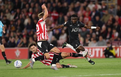 080926 - Southampton v Swansea City, EFL Sky Bet Championship - Joseph Opoku of Swansea City is tackled by Keven Schlotterbeck of Southampton