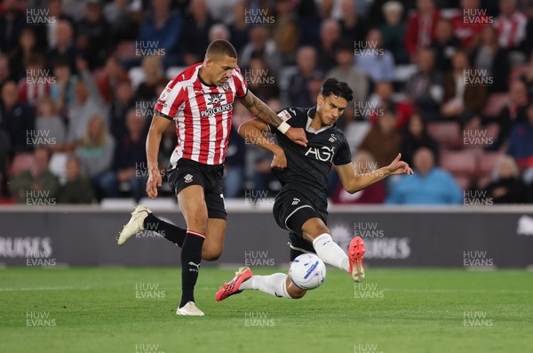 080926 - Southampton v Swansea City, EFL Sky Bet Championship - Marko Stamenic of Swansea City looks to shoot as Nathan Wood of Southampton closes in