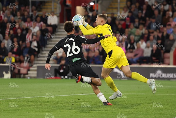 080926 - Southampton v Swansea City, EFL Sky Bet Championship - Southampton goalkeeper Daniel Peretz takes the ball as Filip Lissah of Swansea City closes in