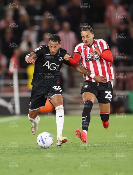 080926 - Southampton v Swansea City, EFL Sky Bet Championship - Ronald of Swansea City and Southampton goalkeeper George Long compete for the ball