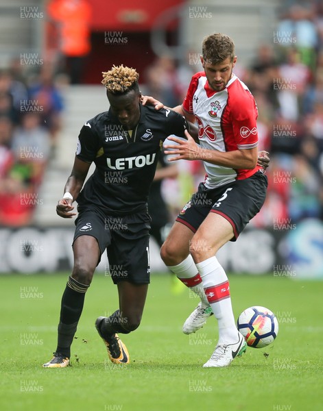 120817 - Southampton v Swansea City, Premier League - Tammy Abraham of Swansea City and Jack Stephens of Southampton compete for the ball