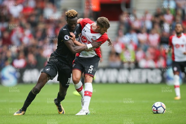 120817 - Southampton v Swansea City, Premier League - Tammy Abraham of Swansea City and Jack Stephens of Southampton compete for the ball