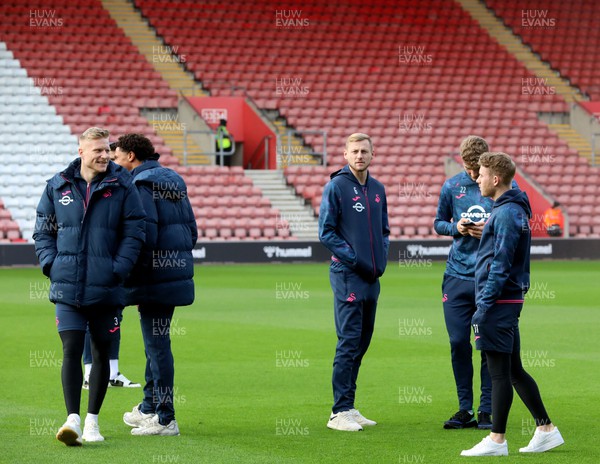 261223 - Southampton v Swansea City - Sky Bet Championship - Swansea players check out the pitch on arrival