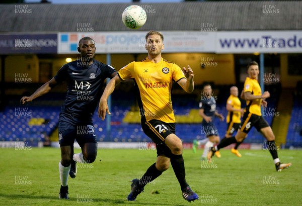 080817 - Southend United v Newport County - Carabao Cup - Southend's Theo Robinson battles Mickey Demetriou 