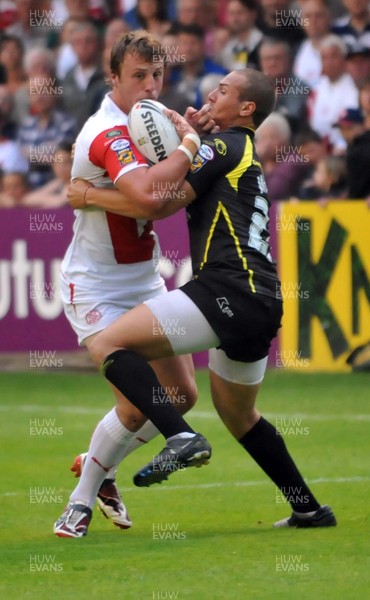 26.06.09 St Helens V Celtic Crusaders. Engage Super League Saints  Chris Dean is tackled by  Celtics Lloyd White  in the Engage Super League game at the GPW Stadium. 