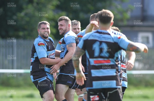 280821 - St Peters v Rumney - WRU National Plate -   Players of Rumney celebrate at the final whistle