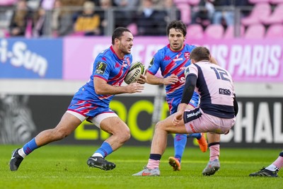 061225 - Stade Francais v Cardiff Rugby - EPCR Challenge Cup - Julien Delbouis of Stade Francais takes on Steffan Emanuel of Cardiff 