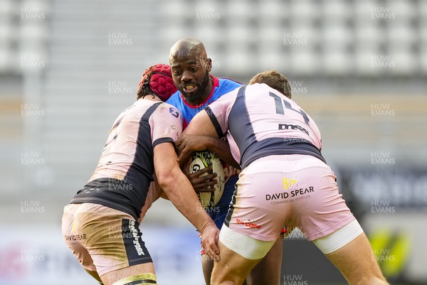061225 - Stade Francais v Cardiff Rugby - EPCR Challenge Cup - Lester Etien of Stade Francais is tackled by Mason Grady of Cardiff (R)