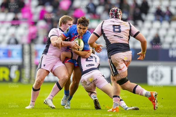 061225 - Stade Francais v Cardiff Rugby - EPCR Challenge Cup - Thibaut Motassi Dibongue of Stade Francais is tackled by Ieuan Davies of Cardiff (21)