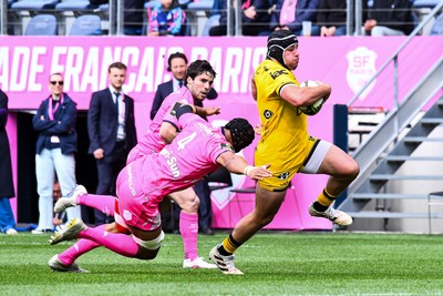 050426 - Stade Francais v Dragons RFC - EPCR Challenge Cup Round of 16 - Rodrigo Martinez of Dragons takes on Pierre-Henri Azagoh of Stade Francais 