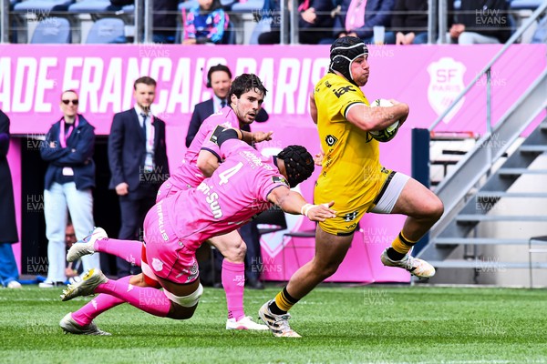 050426 - Stade Francais v Dragons RFC - EPCR Challenge Cup Round of 16 - Rodrigo Martinez of Dragons takes on Pierre-Henri Azagoh of Stade Francais 
