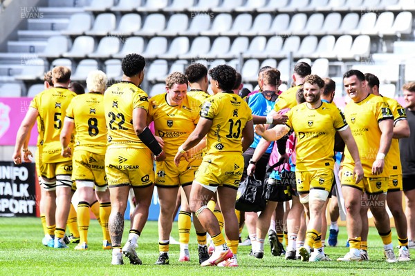 050426 - Stade Francais v Dragons RFC - EPCR Challenge Cup Round of 16 - Dragons players celebrate after the match