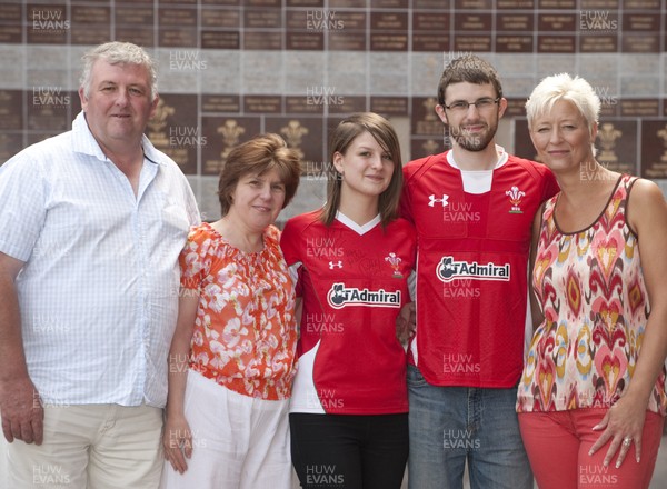 200612 - Stadium Proposal - Mark Roberts and Abbie Cockerill outside the Millennium Stadium, CardiffMark proposed to Abbie during a Wales Rugby Union match at the stadiumPictured are LtR: Hugh Roberts, Sylvia Roberts, Abbie Cockerill, Mark Roberts and Helen Cockerill