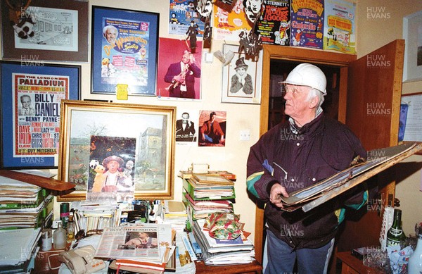 080199 Welsh comedian and former Coronation Street star Stan Stennett checks out the remains of his souvenirs at his fire damaged home in Cardiff