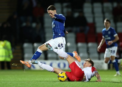 091225 - Stevenage FC v Cardiff City - SkyBet League One - Cian Ashford of Cardiff is tackled by Carl Piergianni of Stevenage 