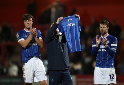 091225 - Stevenage FC v Cardiff City - SkyBet League One - Cardiff staff member holds up at shirt with RIP Gogsey printed