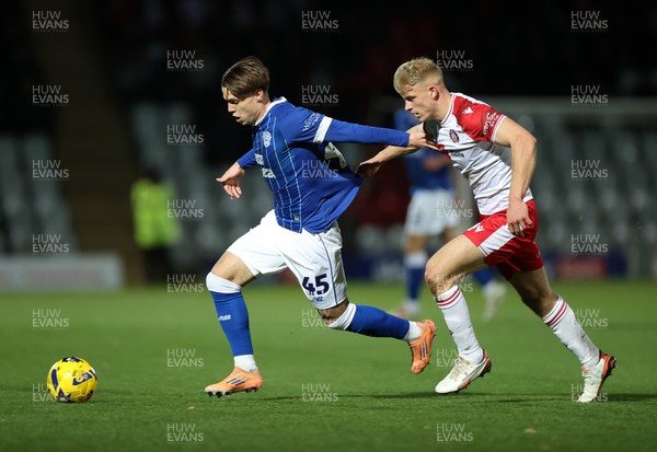 091225 - Stevenage FC v Cardiff City - SkyBet League One - Cian Ashford of Cardiff is challenged by Saxon Earley of Stevenage 