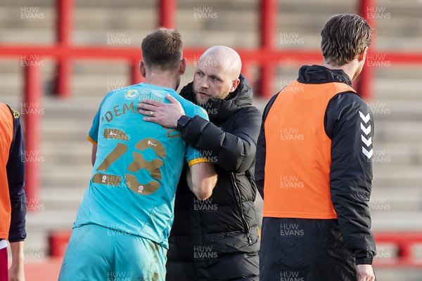 120322 - Stevenage v Newport County - Sky Bet League 2 - Newport County Manager James Rowberry embraces Mickey Demetriou of Newport County after his side's victory