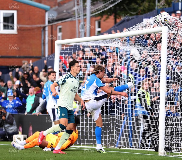 130925 - Stockport County v Cardiff City - Sky Bet League 1 - Yousef Saleh of Cardiff celebrates scoring the equaliser past Corey Addai of Stockport in the last seconds of the match as Brad Hills of Stockport kicks the ball up in anger
