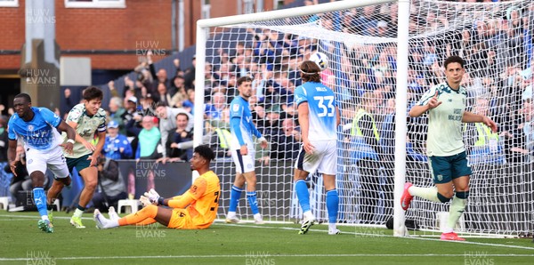 130925 - Stockport County v Cardiff City - Sky Bet League 1 - Yousef Saleh of Cardiff celebrates scoring the equaliser past Corey Addai of Stockport in the last seconds of the match as Brad Hills of Stockport kicks the ball up in anger