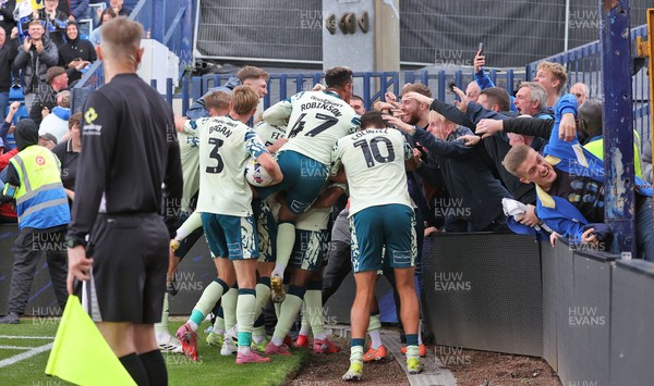 130925 - Stockport County v Cardiff City - Sky Bet League 1 - Yousef Saleh of Cardiff celebrates scoring the equaliser in the last seconds of the match with Chris Willock of Cardiff and Rubin Colwill of Cardiff with team and fans