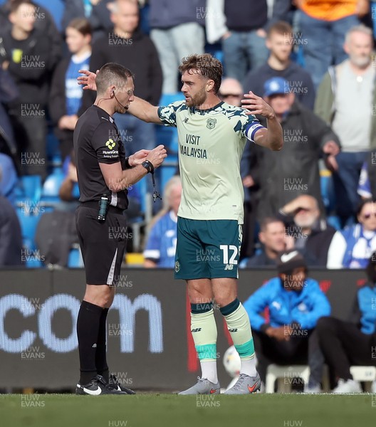 130925 - Stockport County v Cardiff City - Sky Bet League 1 - Calum Chambers of Cardiff reasons with referee Simon Mather about penalty