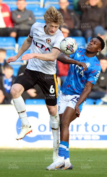 090324 - Stockport County v Newport County - Sky Bet League 2 - Declan Drysdale of Newport County and Isaac Olaofe of Stockport County