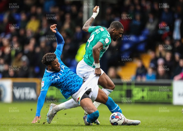 100423 - Stockport County v Newport County - Sky Bet League 2 - Omar Bogle of Newport County is tackled by Kyle Wootton of Stockport County
