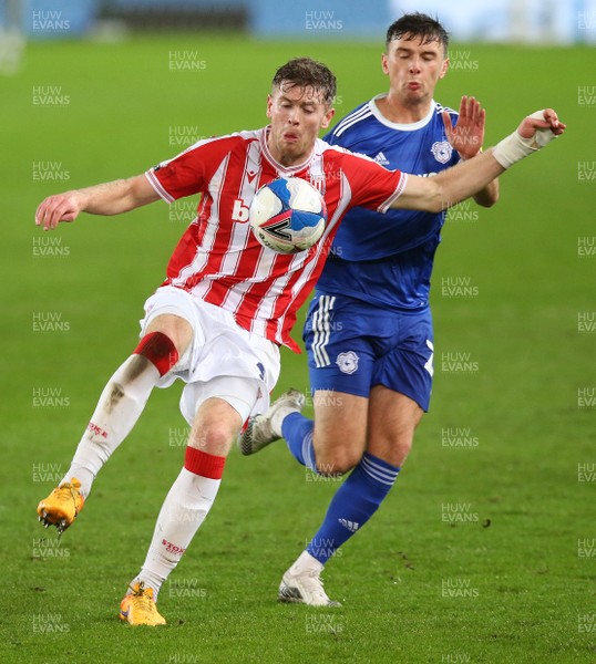 081220 - Stoke City v Cardiff City - Sky Bet Championship - Nathan Collins of Stoke Cityprotects the ball from Mark Harris of Cardiff   