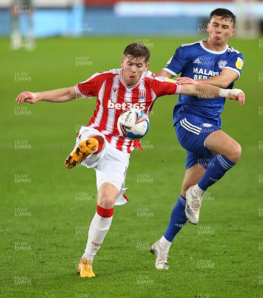 081220 - Stoke City v Cardiff City - Sky Bet Championship - Nathan Collins of Stoke Cityprotects the ball from Mark Harris of Cardiff   