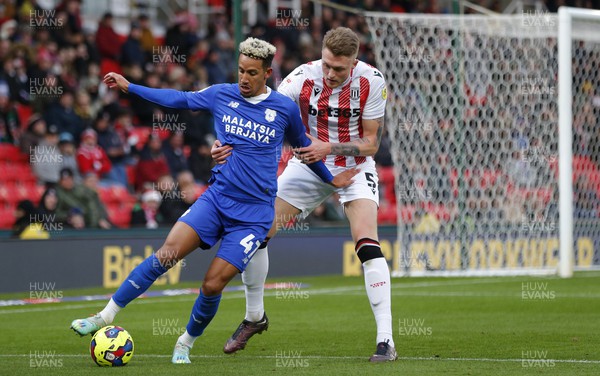 101222 - Stoke City v Cardiff City - Sky Bet Championship - Callum Robinson of Cardiff and Harry Souttar of Stoke City