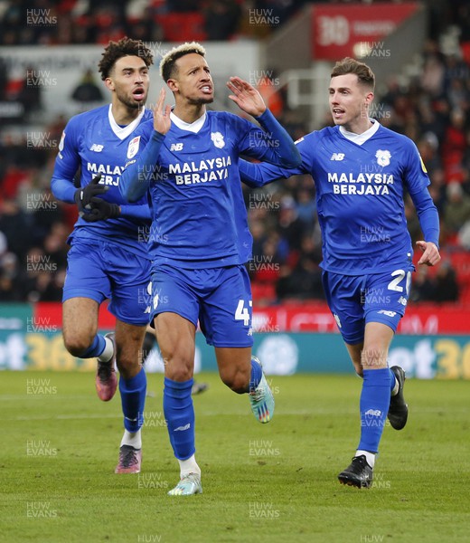 101222 - Stoke City v Cardiff City - Sky Bet Championship - Callum Robinson of Cardiff celebrates scoring a goal with Kion Etete of Cardiff and Gavin Whyte of Cardiff