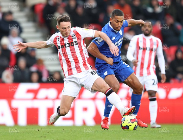 101222 - Stoke City v Cardiff City - Sky Bet Championship - Andy Rinomhota of Cardiff and Jordan Thompson of Stoke City