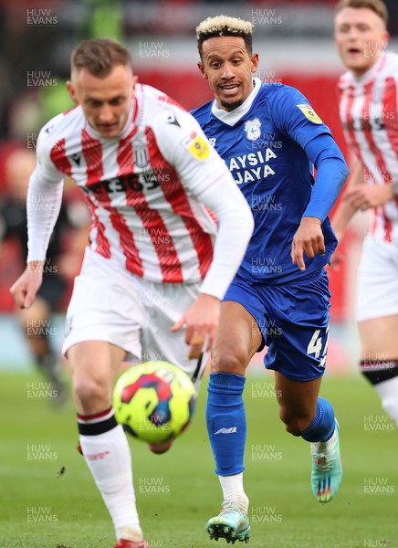 101222 - Stoke City v Cardiff City - Sky Bet Championship - Callum Robinson of Cardiff chases Ben Wilmot of Stoke City