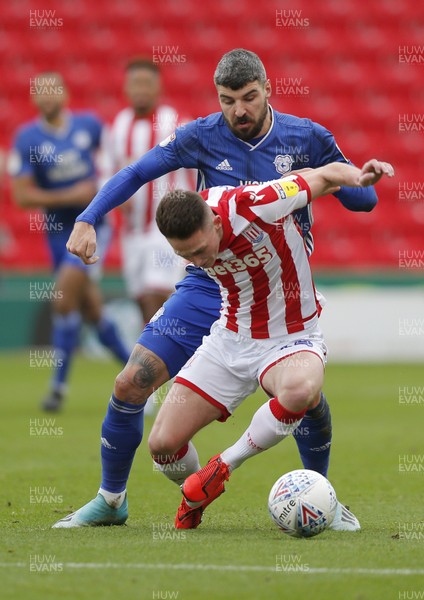 220220 - Stoke City v Cardiff City - Sky Bet Championship - Jordan Thompson of Stoke City is challenged by Callum Paterson of Cardiff   