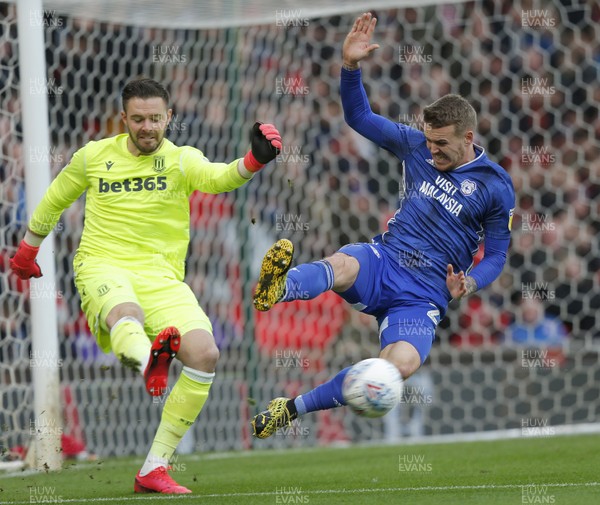 220220 - Stoke City v Cardiff City - Sky Bet Championship - Danny Ward of Cardiff challenges Goalkeeper Jack Butland of Stoke City for the ball in the 1st half   