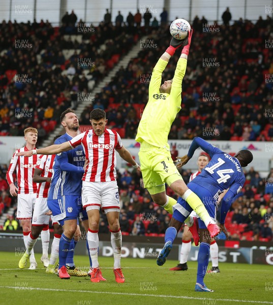 220220 - Stoke City v Cardiff City - Sky Bet Championship - Goalkeeper Jack Butland of Stoke City saves from a throw in by Will Vaulks of Cardiff   