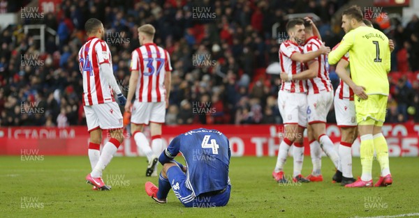 220220 - Stoke City v Cardiff City - Sky Bet Championship - Sean Morrison of Cardiff is floored by the bad result for Cardiff at the end of the game   