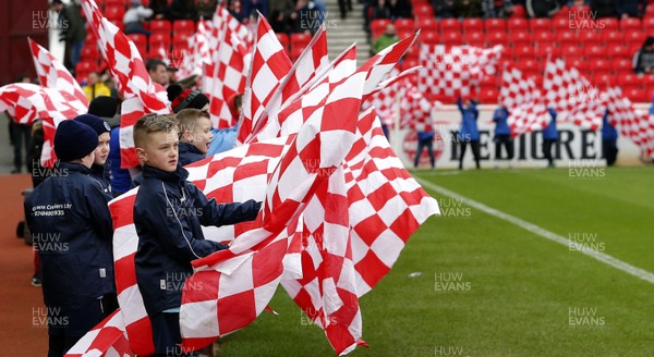 220220 - Stoke City v Cardiff City - Sky Bet Championship - Children wave flags to welcome players on to the pitch   