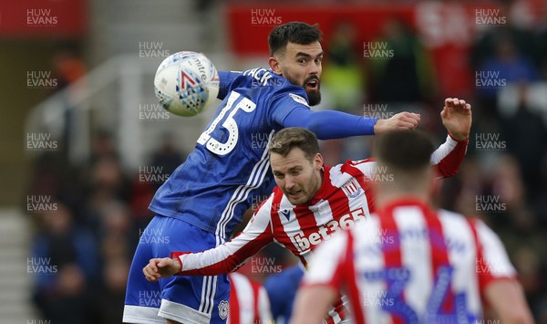 220220 - Stoke City v Cardiff City - Sky Bet Championship - Marlon Pack of Cardiff and Nick Powell of Stoke City  