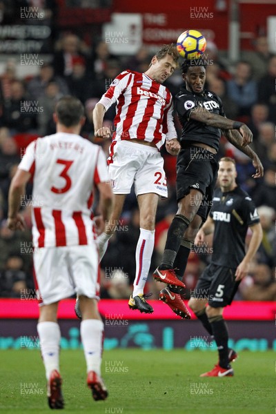 021217 - Stoke City v Swansea City, Premier League - Peter Crouch of Stoke City (left) and Leroy Fer of Swansea City battle for the ball