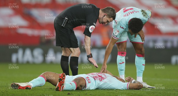 030321 - Stoke City v Swansea City - Sky Bet Championship - Andre Ayew of Swansea receives treatment on the pitch