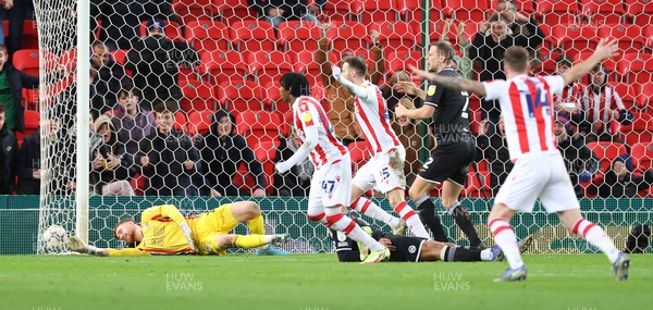 080222 - Stoke City v Swansea City - Sky Bet Championship - Goalkeeper Andy Fisher of Swansea can't keep the ball out for the 2nd Stoke goal