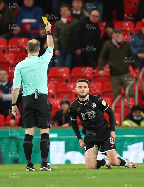 080222 - Stoke City v Swansea City - Sky Bet Championship - Matt Grimes of Swansea gets a yellow card from referee Jeremy Simpson