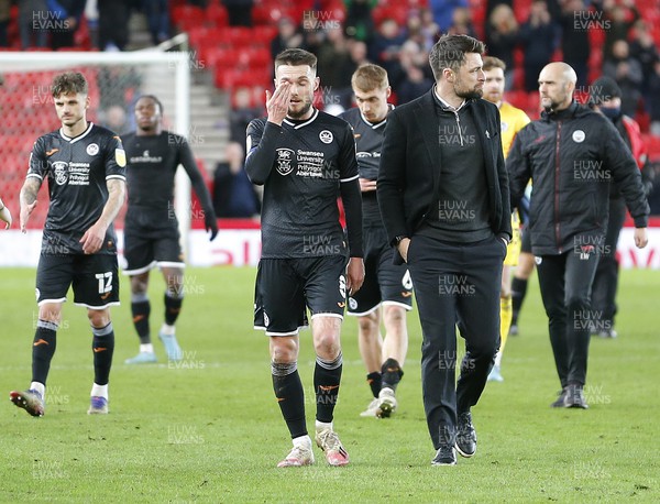 080222 - Stoke City v Swansea City - Sky Bet Championship - Head Coach Russell Martin  of Swansea leads a dejected team off the pitch at full time losing 3-0