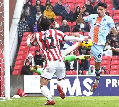 131225 - Stoke City v Swansea City - Sky Bet Championship - Goalkeeper Viktor Johansson of Stoke  makes a spectacular save from Marko Stamenic of Swansea in the 1st half with Tatsuki Seko of Stoke back up